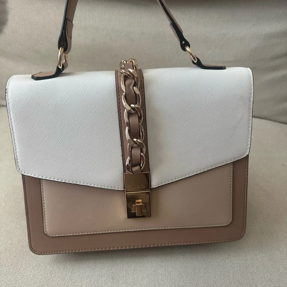 ALDO women's handbag with a top handle and chain detail.